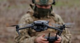 a soldier operating a drone