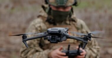 a soldier operating a drone