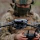 a soldier operating a drone