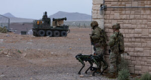Soldiers operating an autonomous "dog" system and a robotic combat vehicle. Photo: Spc. Samarion Hicks/US Army