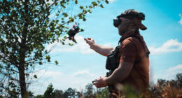 An Unmanned Aerial Vehicle (UAV) drone operator assigned to 1st Special Forces Command (Airborne) releases a UAV for a flight demonstration at a counter- drone range in Ellerbe, North Carolina, May 5, 2026. UAVs are flown using First Person View (FPV) goggles to see real-time, immersive video feed from the drone's internal camera. This photo has been altered to protect the identity of the operator. (U.S. Army photo by Ssg. Gabriel E. Davis)