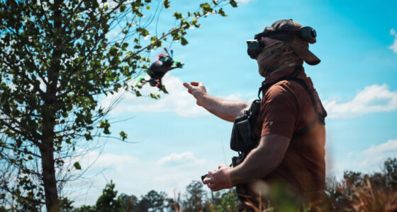 An Unmanned Aerial Vehicle (UAV) drone operator assigned to 1st Special Forces Command (Airborne) releases a UAV for a flight demonstration at a counter- drone range in Ellerbe, North Carolina, May 5, 2026. UAVs are flown using First Person View (FPV) goggles to see real-time, immersive video feed from the drone's internal camera. This photo has been altered to protect the identity of the operator. (U.S. Army photo by Ssg. Gabriel E. Davis)