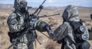 Troops preparing a R80D SkyRaider for chemical, biological, radiological, and nuclear (CBRN) mission