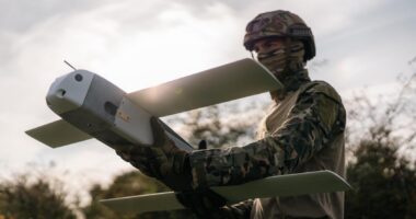Soldier preparing a Toutatis loitering munition for launch