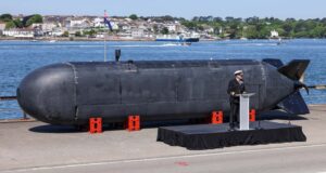 An officer speaks next to the Excalibur unmanned underwater vehicle, which is expected to be integrated into the Atlantic Bastion program. Image: British Royal Navy