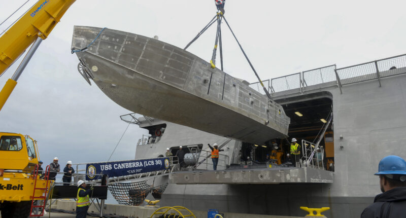 An unmanned surface vehicle is craned aboard the Independence-variant littoral combat ship USS Canberra (LCS 30), as a part of the first embarkation of the Mine Countermeasures (MCM) mission package, April 23. The MCM mission package is an integrated suite of unmanned maritime systems and sensors which locates, identifies, and destroys mines in the littorals while increasing the ship’s standoff distance from the threat area. Littoral Combat Ships are fast, optimally-manned, mission-tailored surface combatants that operate in near-shore and open-ocean environments, winning against 21st-century coastal threats. (U.S. Navy photo by Mass Communication Specialist 1st Class Vance Hand)