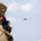 U.S. Soldiers assigned to 3rd Squadron, 2nd Cavalry Regiment practice target lock-on against an incoming drone during Project Flytrap at Joint Multinational Readiness Center, Hohenfels Training Area, Hohenfels, Germany, June 9, 2025. The Soldiers attached a Smartshooter SMASH 2000L to M4A1 carbine rifles for improved sight picture and accuracy. (U.S. Army photo by Spc. Elijah Magaña)